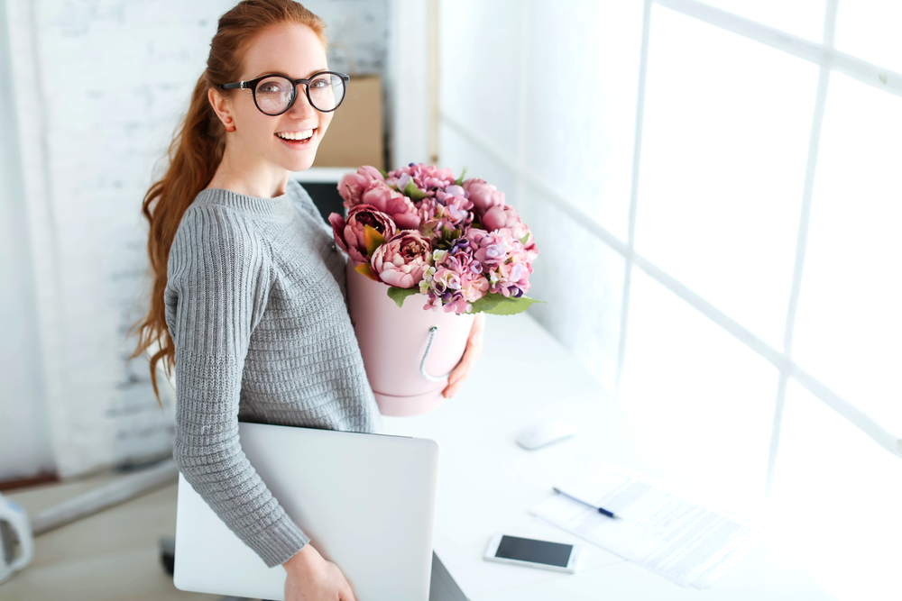 Beautiful,young,woman,with,red,hair,,an,office,worker,at
