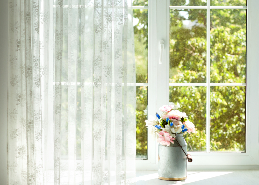 Window,with,curtains,and,flowers